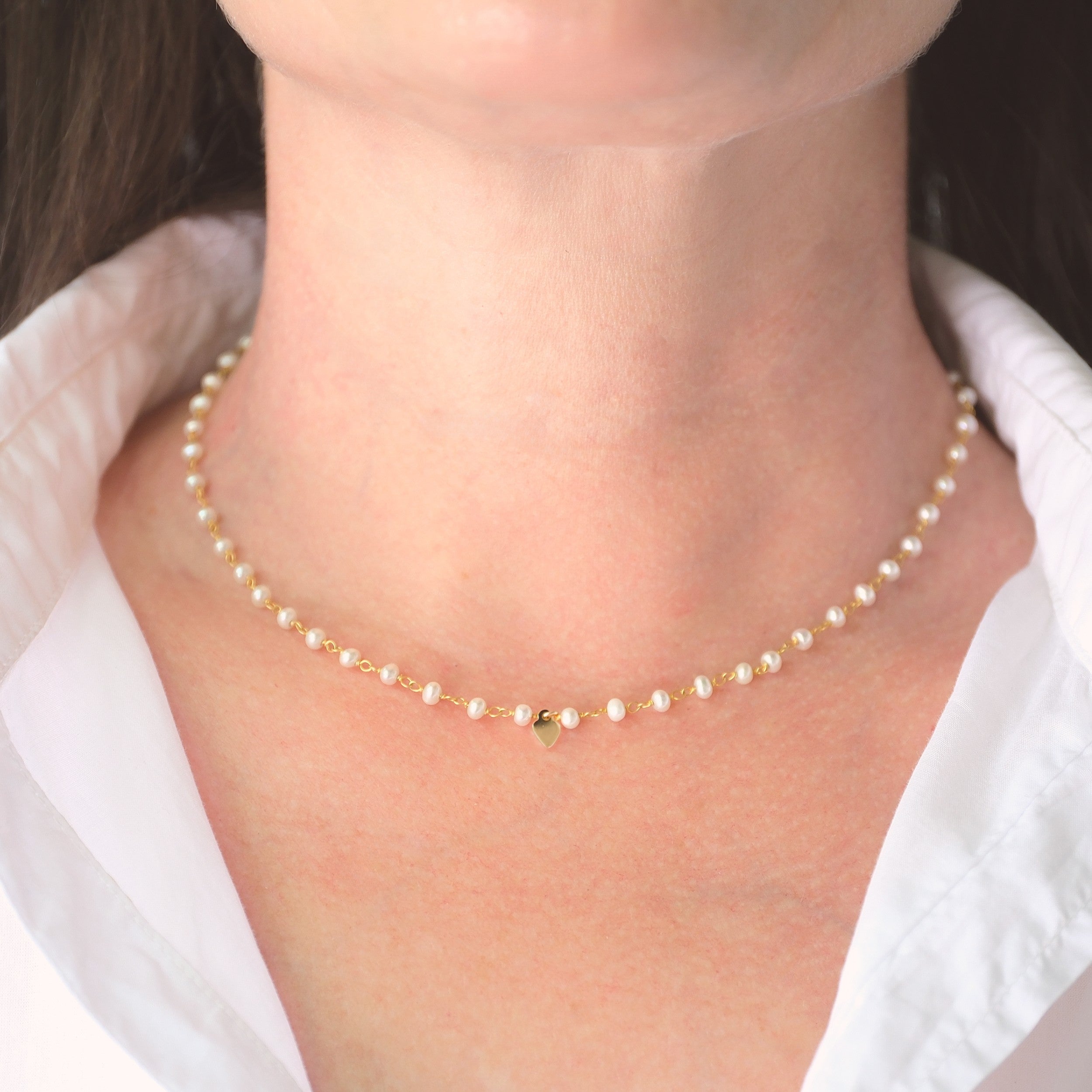 Wire-wrapped pearl necklace with gold heart charm
