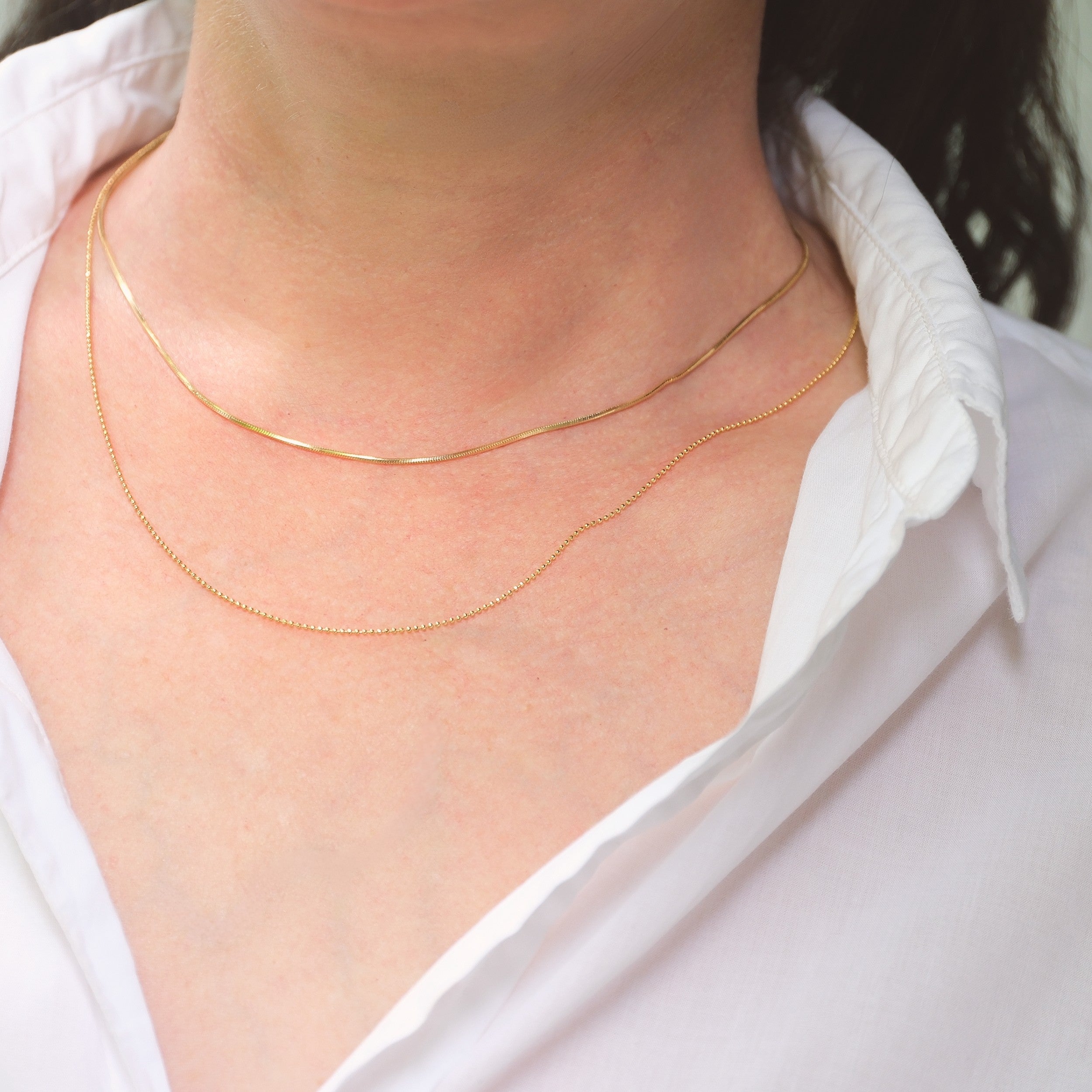 delicate gold snake chain necklace